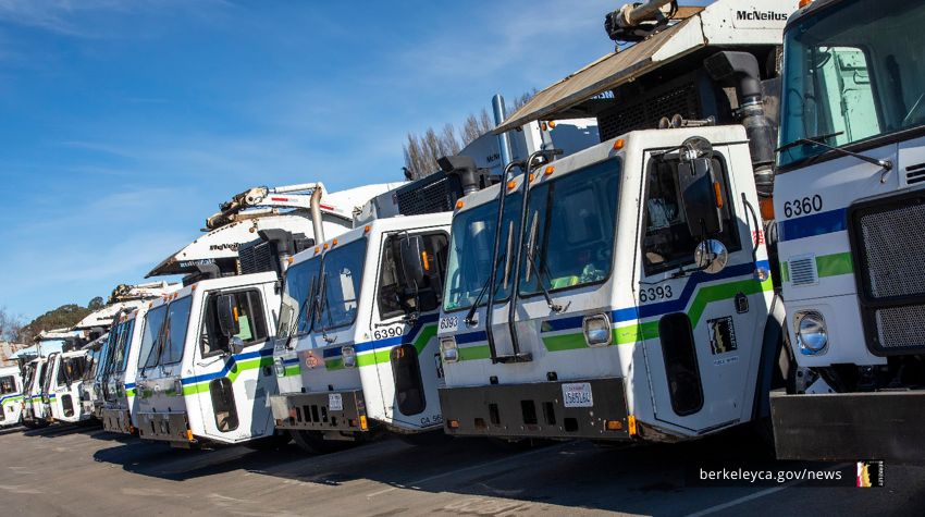 Row of waste collection vehicles